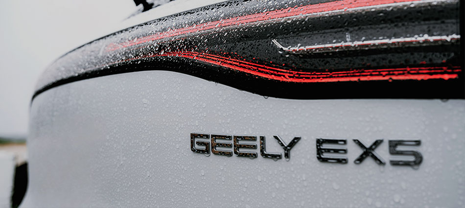 Close up detail of a Geely EX5 rear badge