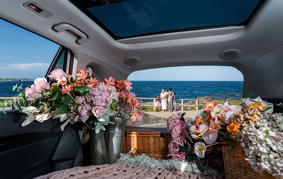 Flowers in the rear of a Geely EX5 with the seats layed flat