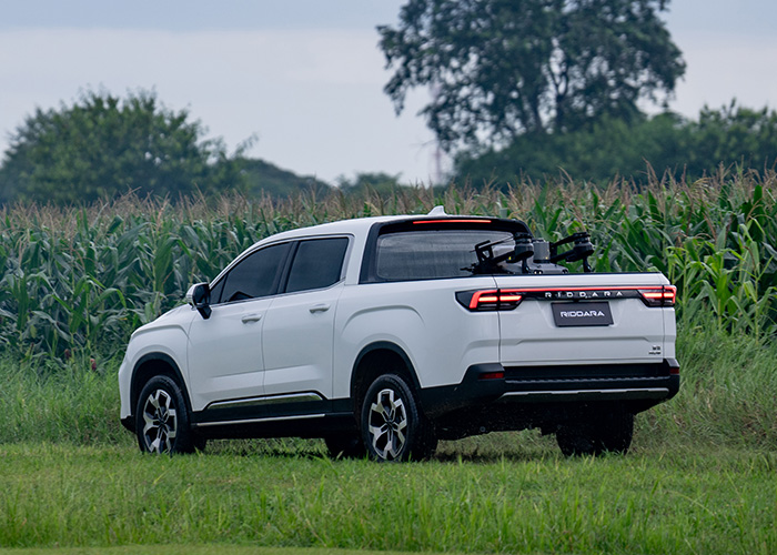 Rear of a white Riddara parked off-road