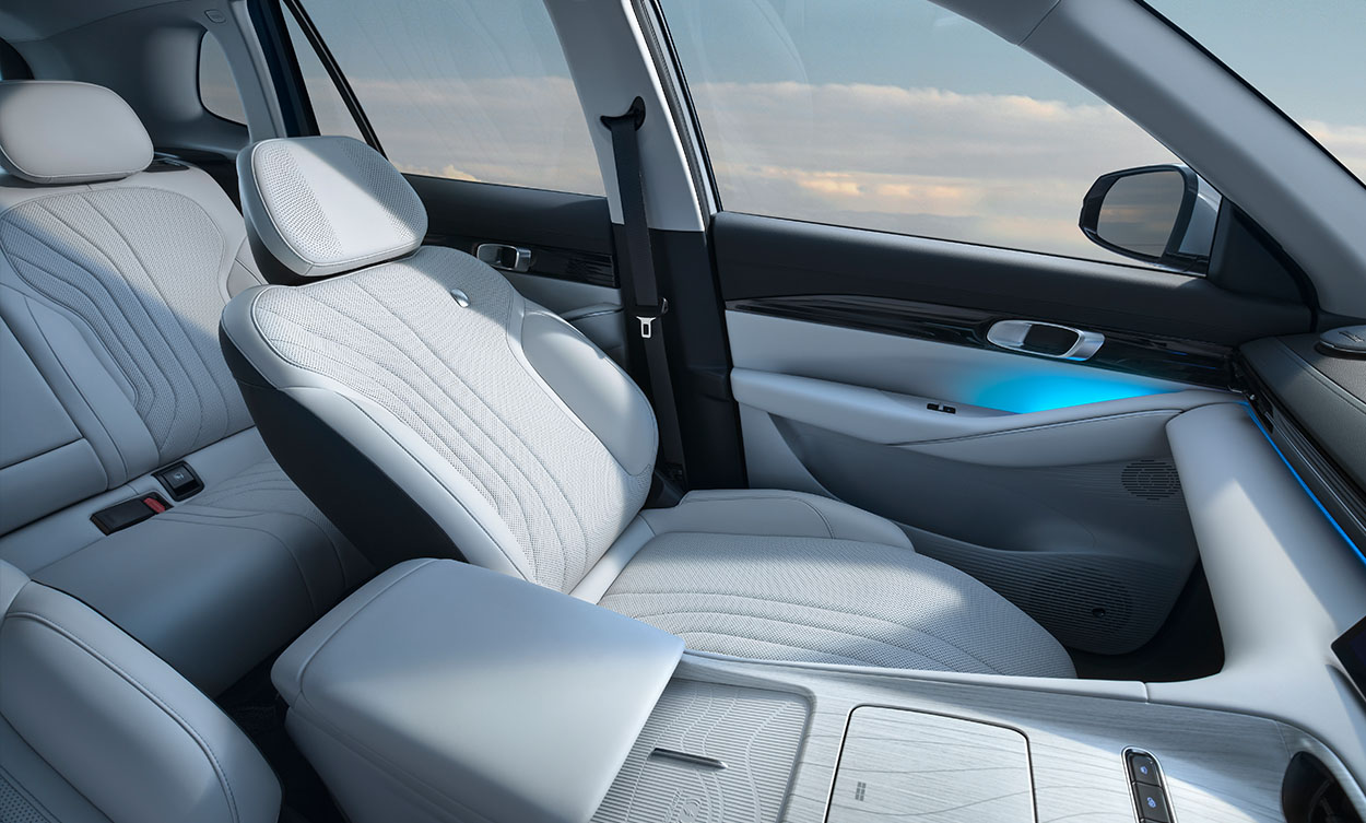 White upholstery in a Geely SUV, with the passenger seat reclined
