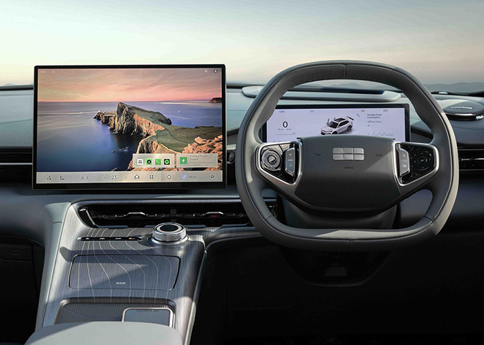 Close up of a steering wheel and display screen in a Geely
